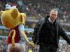 Good sport: Villa boss Paul Lambert shakes hands with the mascot before the game