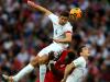 Free ride: England captain Steven Gerrard climbed on Luis Advincula to win a header