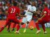 Crowd control: Glen Johnson was surrounded by men as he tried to clear his lines