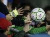 Ouch! A young Bolivia fan gets a really close view of the ball!