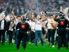 Frankfurt fans were confronted by riot police after invading the pitch Credit: Reuters