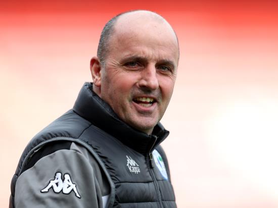 Paul Cook hails Wigan as they move five points clear at League One summit