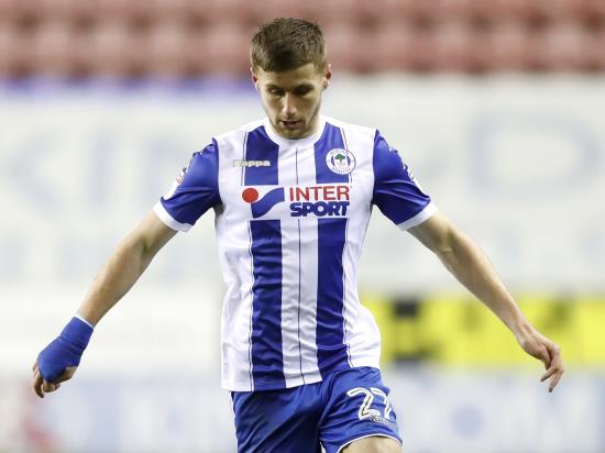 Wigan stay on top thanks to Colclough strike