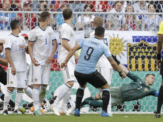 Russia handed reality check as Uruguay claim commanding win to top Group A