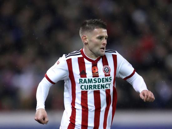 Blades cut down Brentford to stay in touch at the top