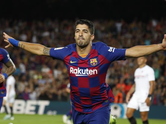 Spectacular Suarez shot inspires nine-man Barcelona success over Sevilla