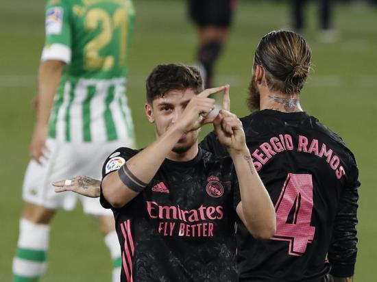 Real Madrid battle to victory over 10-man Real Betis
