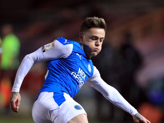 Peterborough move top of League One after easing past Plymouth