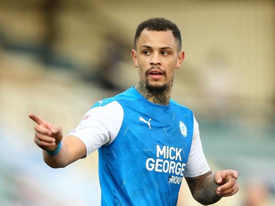Jonson Clarke-Harris penalty salvages draw for Peterborough in dramatic finish