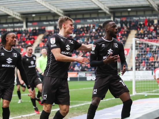 Ten-man MK Dons come from behind to beat leaders Rotherham