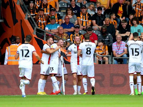 Blades win at Hull to go top of the Championship