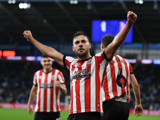 George Baldock goal takes Blades to the top of the Championship