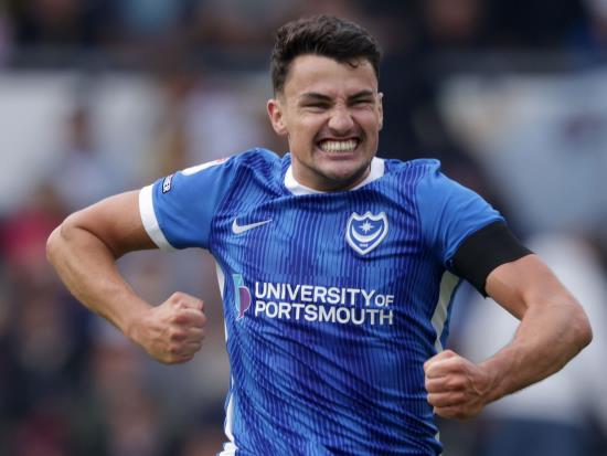 Leaders Portsmouth hit back to beat 10-man Wigan