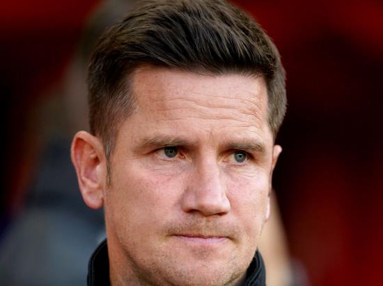 Crewe boss Lee Bell blasts missile-throwing fans after beating nine-man Tranmere