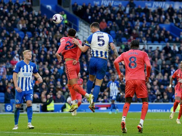 Lewis Dunk’s last-gasp leveller earns 10-man Brighton draw with Everton