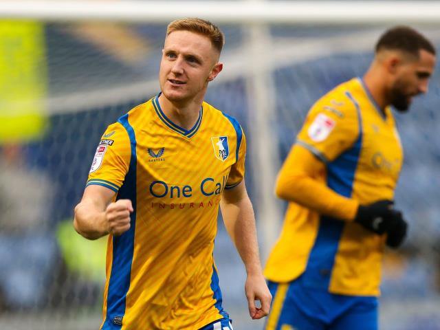 Mansfield crush 10-man Salford and take over at the top of League Two