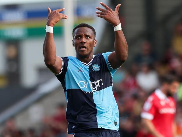 Wycombe hammer Stockport to storm to top of League One