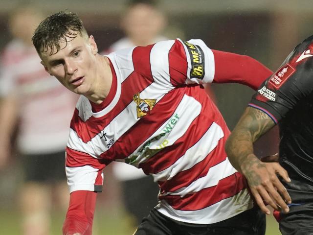 Rob Street on target as 10-man Doncaster edge lowly Morecambe to go third