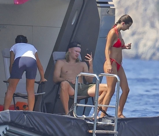 HAALIDAY MODE Erling Haaland finally enjoys delayed holiday as Man City star dives off yacht with glamorous bikini-clad girlfriend