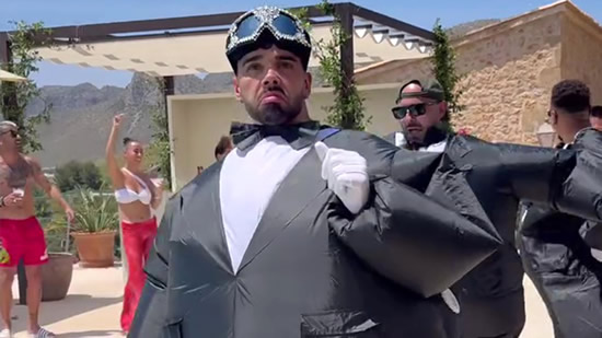 Bizarre moment Arsenal star David Raya and his groomsmen dance into wedding venue wearing inflatable tuxedos