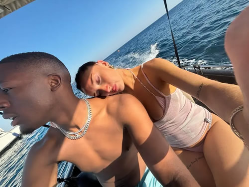 SUN RED Man Utd legend’s daughter puts on busty display as she sizzles in bikini on holiday with Love Island star boyfriend