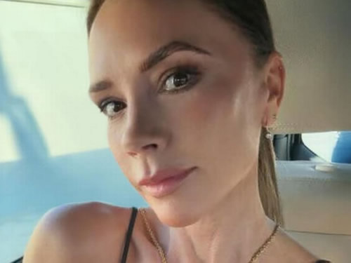 Victoria Beckham poses for David on holiday as she silences critics amid Brooklyn feud