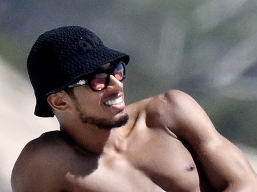 Shouldering on Topless Jude Bellingham shows off shoulder scar after surgery as Real Madrid star relaxes with girlfriend on boat