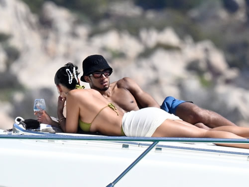 Shouldering on Topless Jude Bellingham shows off shoulder scar after surgery as Real Madrid star relaxes with girlfriend on boat