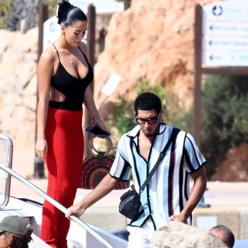 Shouldering on Topless Jude Bellingham shows off shoulder scar after surgery as Real Madrid star relaxes with girlfriend on boat