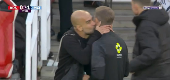 Pep Guardiola bizarrely KISSES fourth official during Arsenal vs Man City as fans baffled by moment of madness