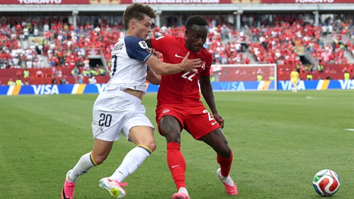 Larin bails out dire David to earn Canada first World Cup point