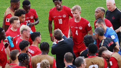Larin bails out dire David to earn Canada first World Cup point