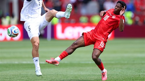 Larin bails out dire David to earn Canada first World Cup point