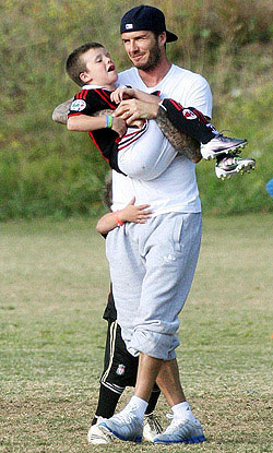 David Beckham messes around in a Beverly Hills park with son Cruz
