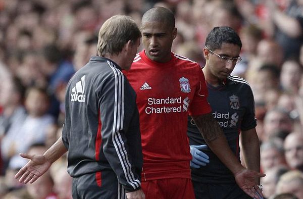 Liverpool 2 Valencia 0: Mixed fortunes for Dalglish as Johnson limps off with hamstring injury but Carroll finds the net