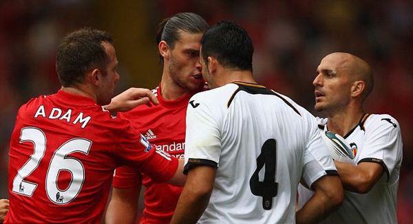 Liverpool 2 Valencia 0: Mixed fortunes for Dalglish as Johnson limps off with hamstring injury but Carroll finds the net