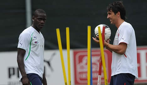 Balotelli's attitude questioned again as City striker plays with iPad on subs bench