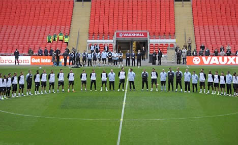 England's solemn display of respect: Capello leads players' in two minutes' silence