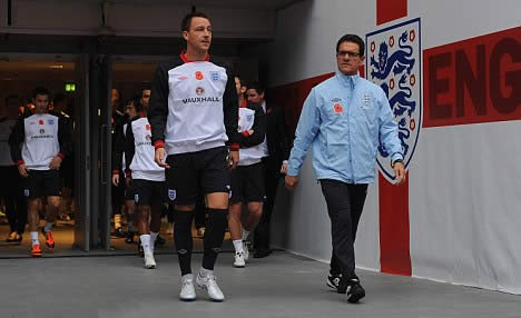 England's solemn display of respect: Capello leads players' in two minutes' silence