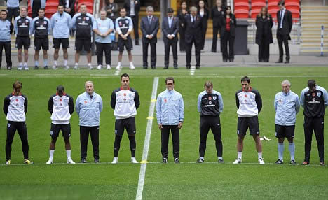 England's solemn display of respect: Capello leads players' in two minutes' silence