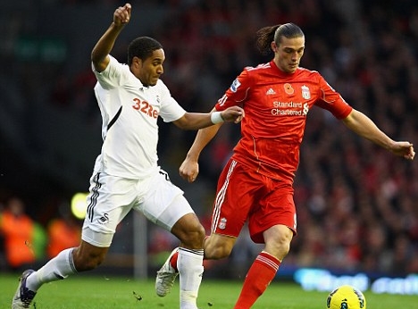 Carroll will play his way into Capello's plans, says Dalglish