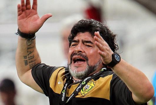 Maradona caught in amazing ruck after fans jeer at wife