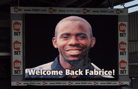 Muamba weeps during emotional return at the Reebok to thank Bolton and Spurs fans for support following his cardiac arrest