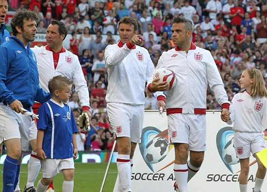 It's meant to be a friendly game! Gordon Ramsay is stretchered off after blistering tackle from Teddy Sheringham at Soccer Aid