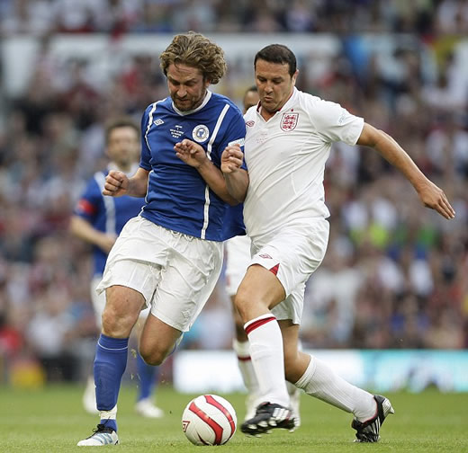 It's meant to be a friendly game! Gordon Ramsay is stretchered off after blistering tackle from Teddy Sheringham at Soccer Aid