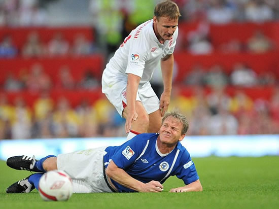 It's meant to be a friendly game! Gordon Ramsay is stretchered off after blistering tackle from Teddy Sheringham at Soccer Aid