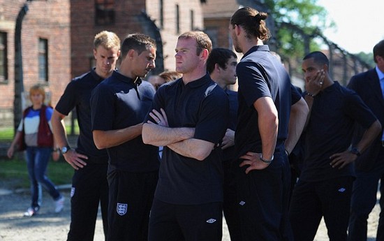 Day football came second: Rooney heads England delegation on emotional tour of harrowing Nazi concentration camp at Auschwitz