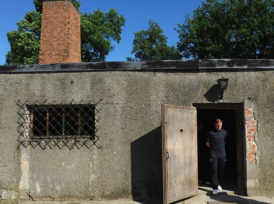 Day football came second: Rooney heads England delegation on emotional tour of harrowing Nazi concentration camp at Auschwitz