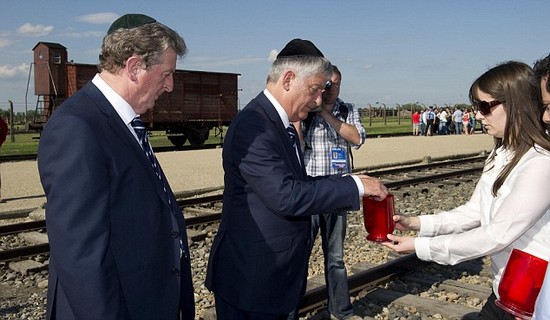 Day football came second: Rooney heads England delegation on emotional tour of harrowing Nazi concentration camp at Auschwitz