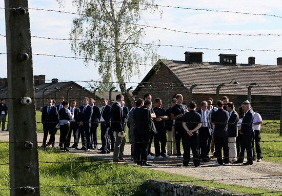 Day football came second: Rooney heads England delegation on emotional tour of harrowing Nazi concentration camp at Auschwitz